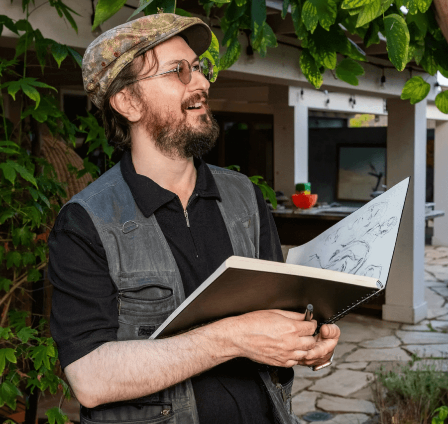 Oleg Tsank Oleg Tsank holding sketch book in hand.