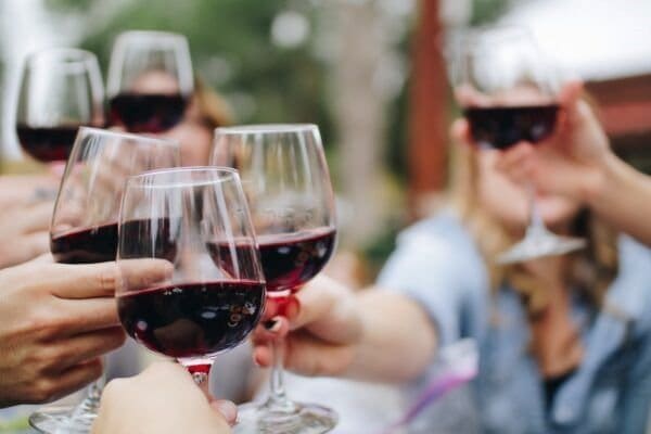 wine Group of people celebrating Mezuzah installation festivities and ribbon-cutting
