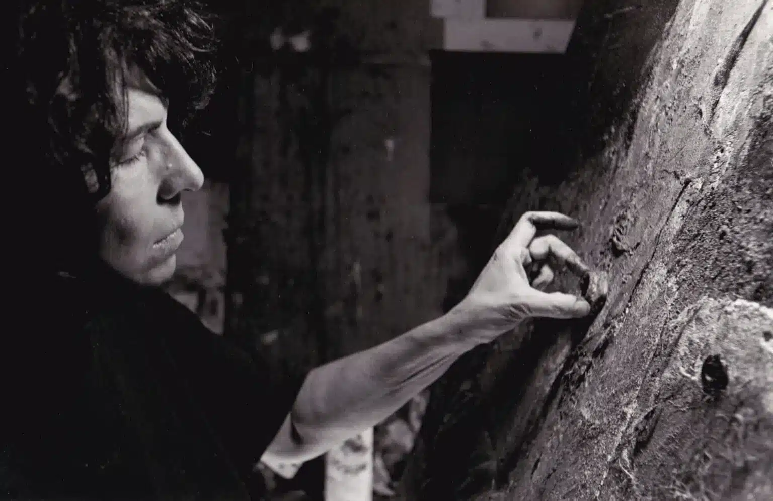 Atara-Baker at work Atara Baker painting with her fingers.